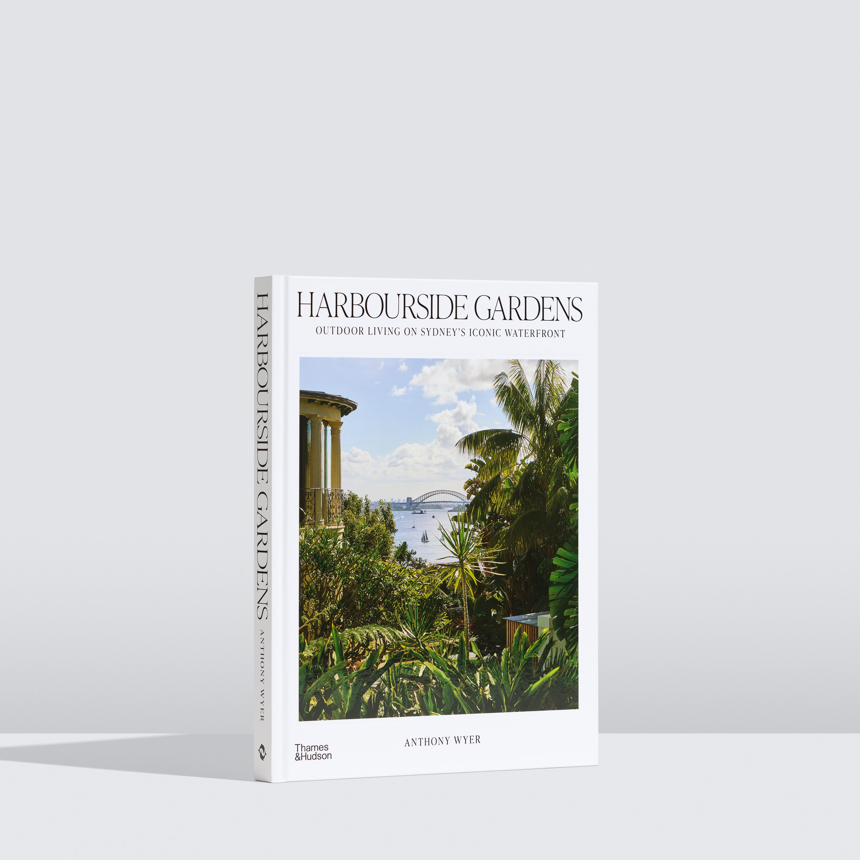Book titled 'Harbourside Gardens' with a scenic cover on a white background