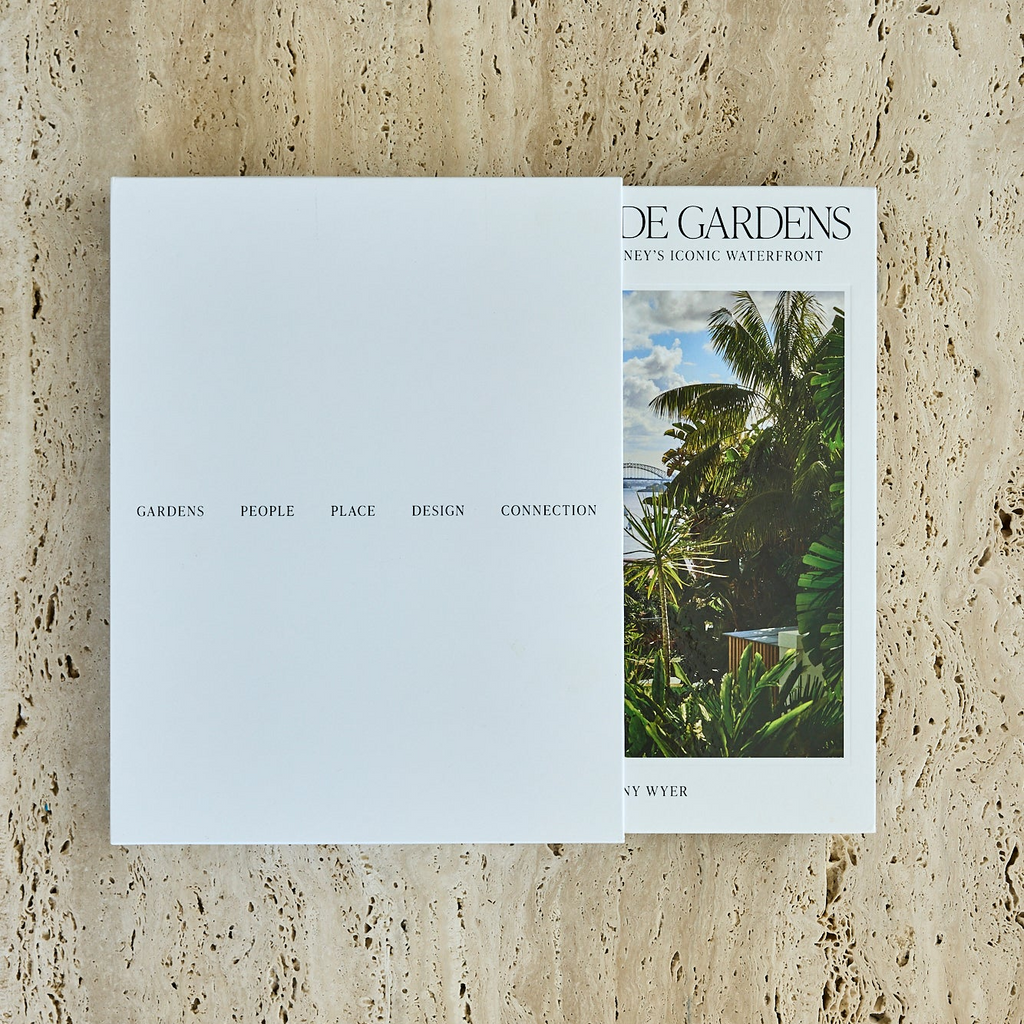 Book titled 'Gardens' with a cover image of a garden on a textured beige surface